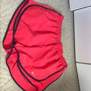 Red and navy/black nike shorts